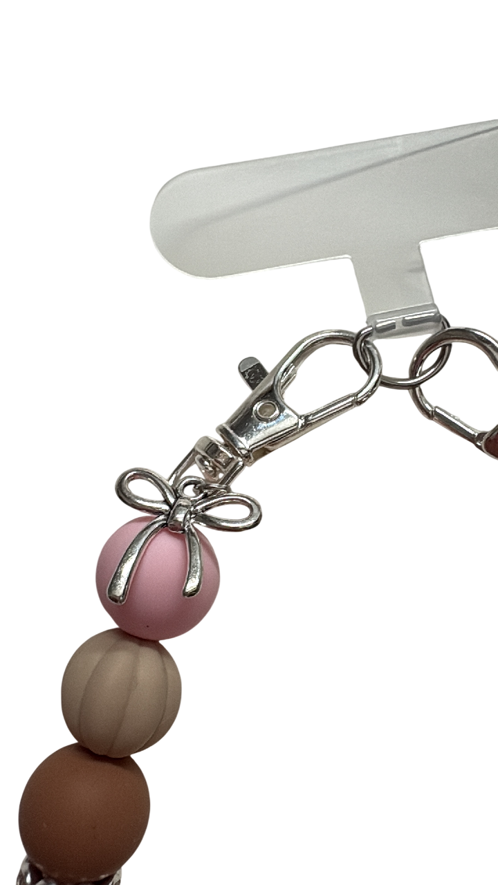 Telefoonketting (pols) beige/roze met bedelstrikje
