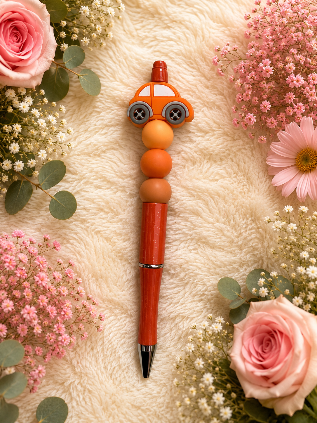 Kralen pen met oranje auto